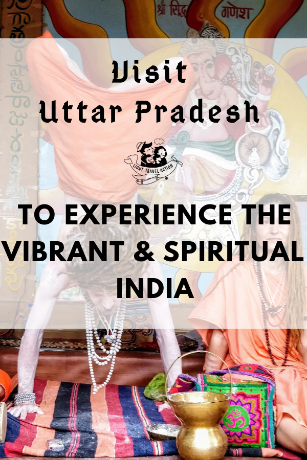 A yogi does handstand as a yogini looks on in Varanasi with text overlay visit Uttar Pradesh to experience vibrant and spiritual India