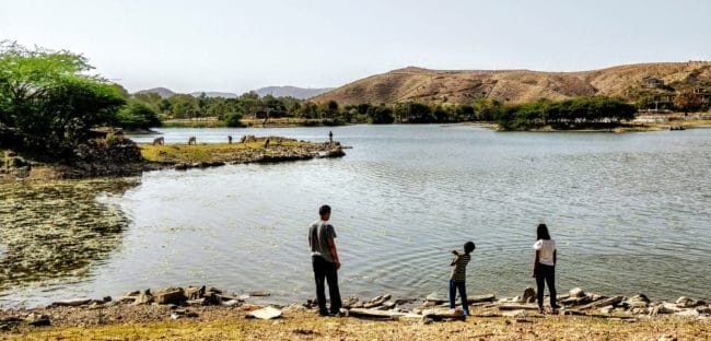 Children playing by lake rajasthan