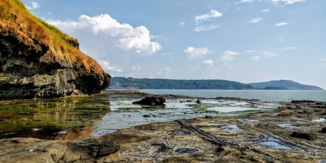 The laterite formation near the 16th Century Shiva Temple at Harihareshwar rocky beach near Shrivardhan in Konkan Maharashtra, India