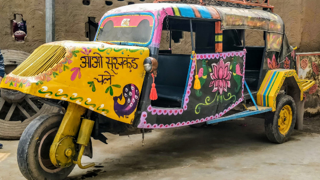 A colourful tuktuk or tempo at Surajkund Mela in Haryana in India which happens to be the Largest Crafts Fair In The World.