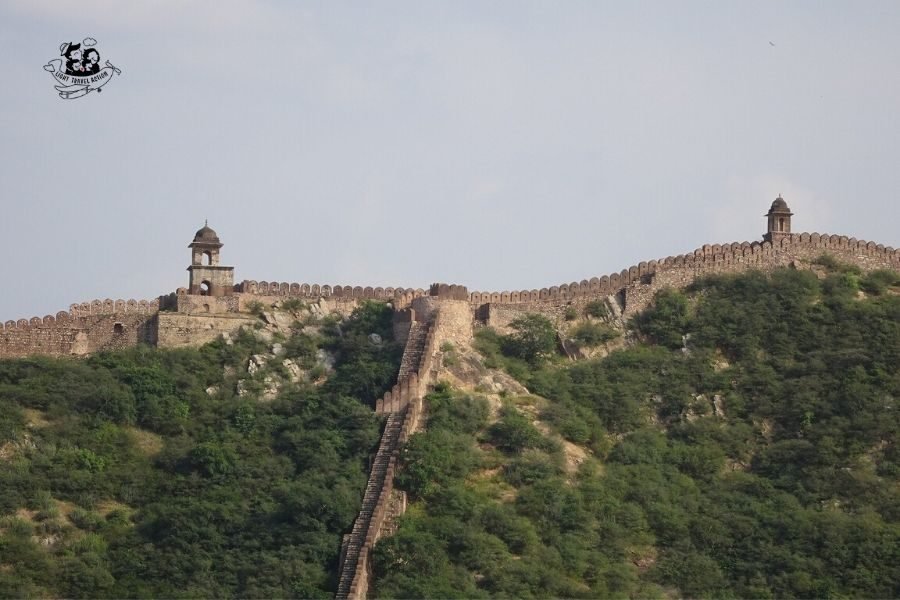 One of the top tourist attractions of Jaipur, the stunning Amer Palace Fort sits atop a small hill, and is located at a distance about 11 km from the main city. Built with pale yellow and pink sandstone, and with white marble, the magnificent Amer Fort is an extensive palace complex. Click to read things to know before your visit #lighttravelaction #amberfortjaipurphotography #amberfort #amberfortjaipur #amberfortphotography #amberfortjaipurarchitecture #amberfortjaipurindia #amerfortjaipurindia