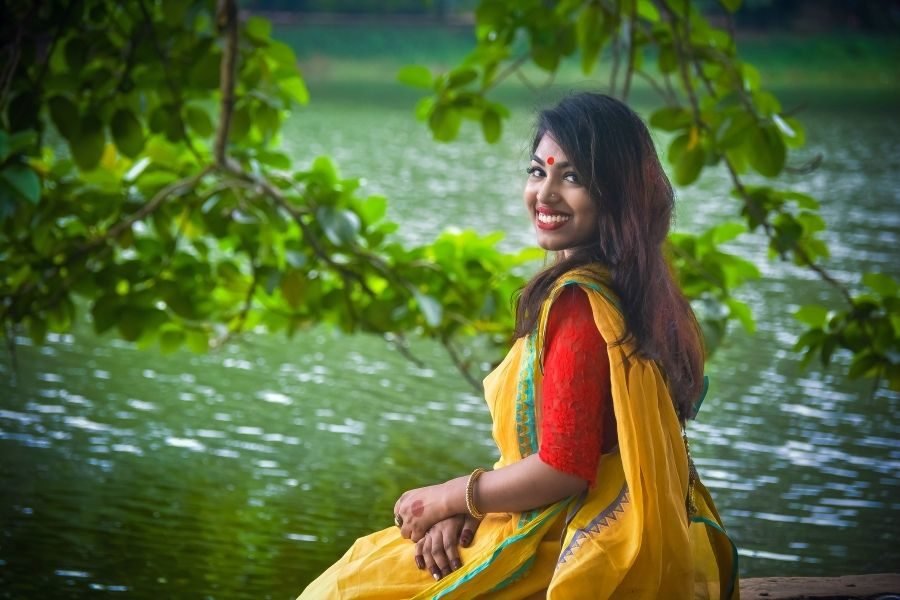 lighttravelaction-namaste-lady-in-yellow-saree